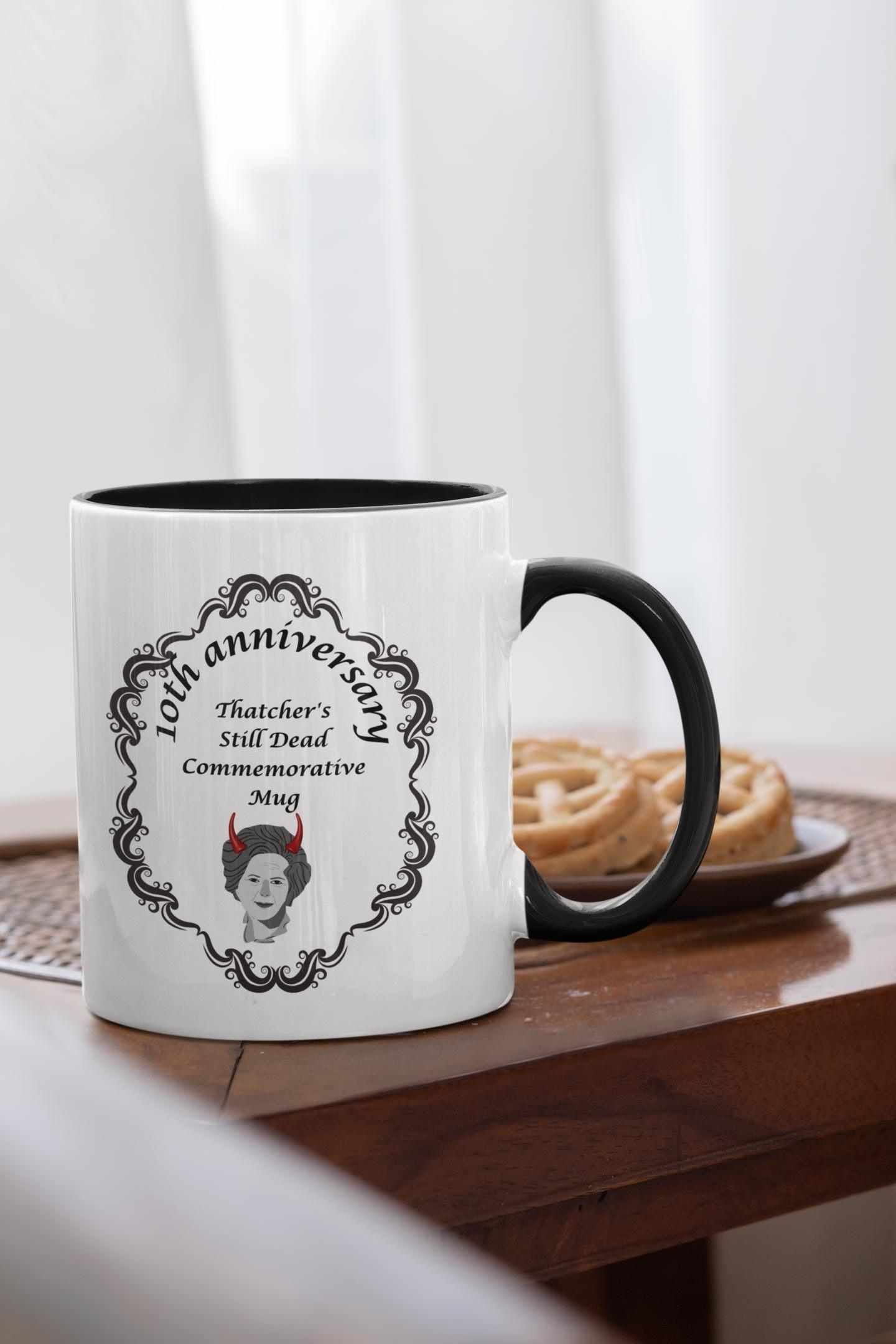 Thatcher Is Still Dead Commemorative 10th Anniversary Mug – ceramic mug featuring a bold political statement.