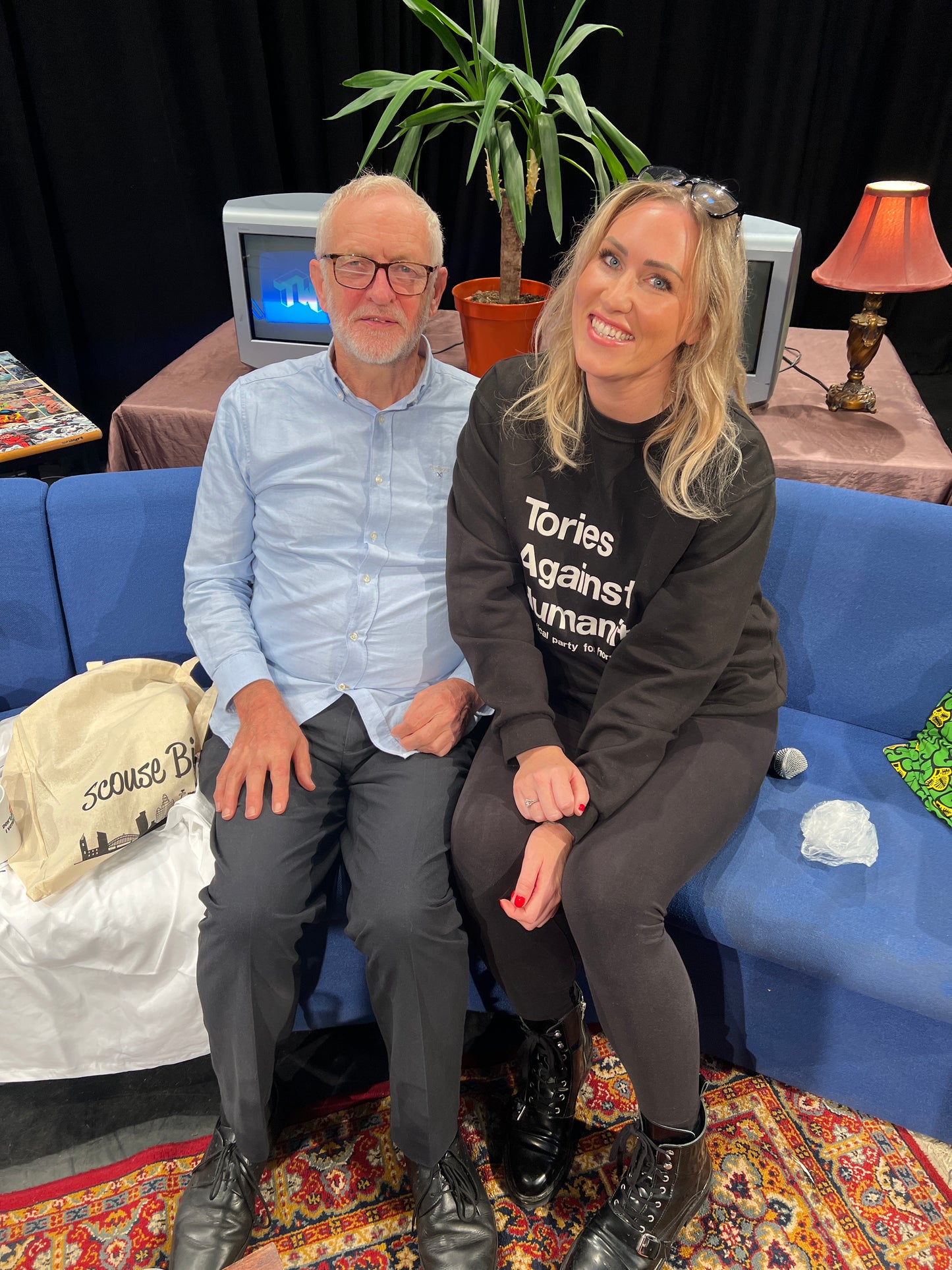 scouse bird and Jeremy corny sitting together scouse bird wearing a tories against humanity sweatshirt