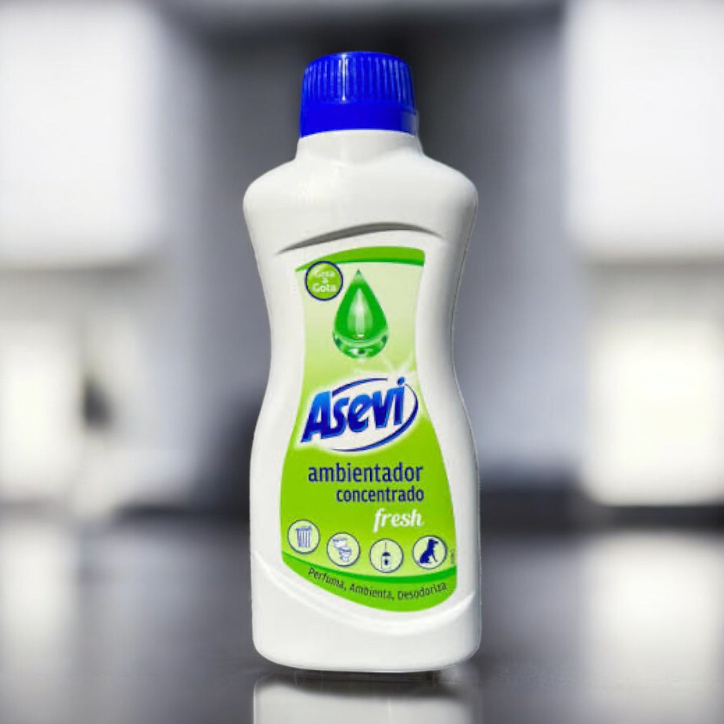 Bottle of Asevi fresh air freshener on a reflective surface with a blurred background