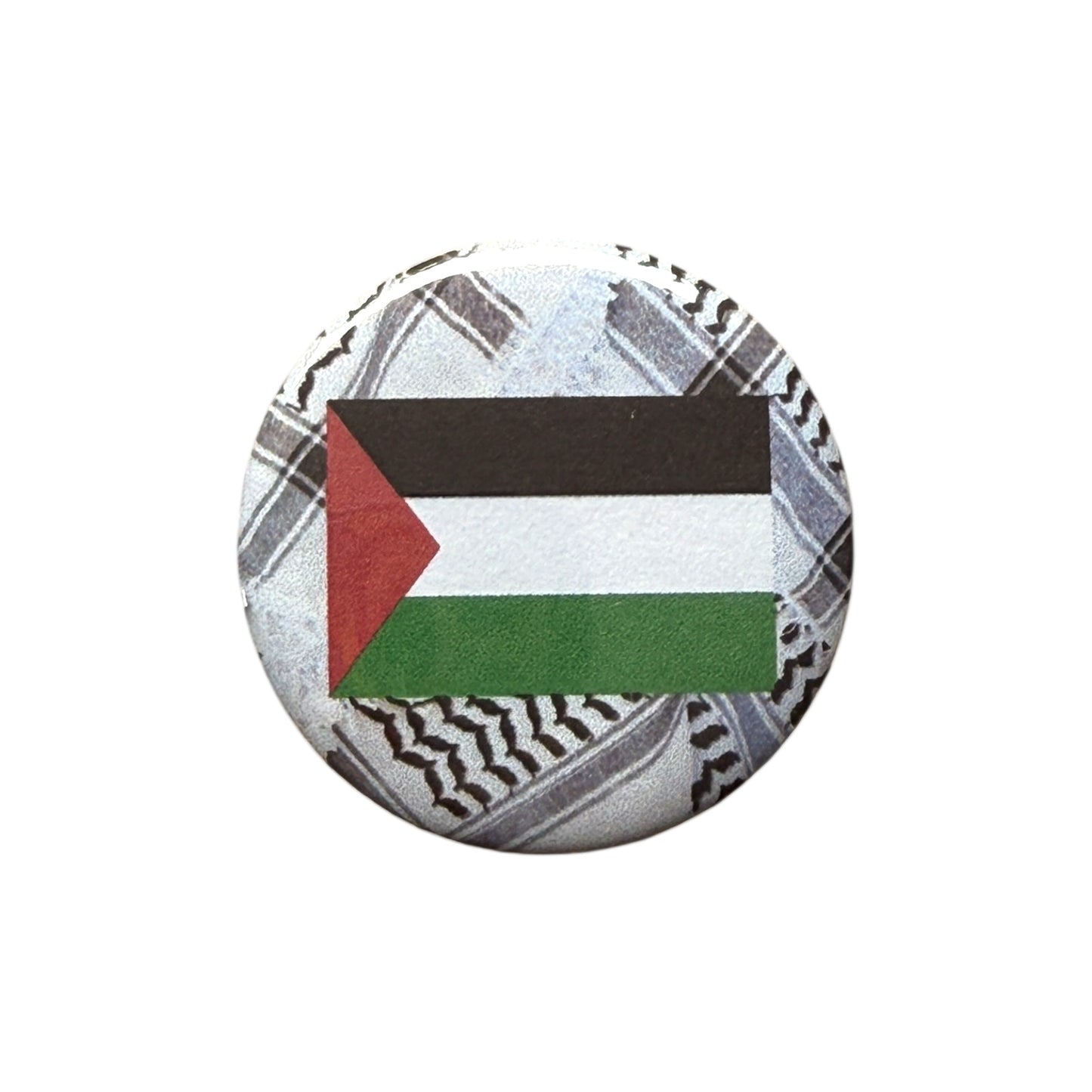 43mm round badge with the Palestinian flag – all profits donated to Gaza families and grassroots organisations.