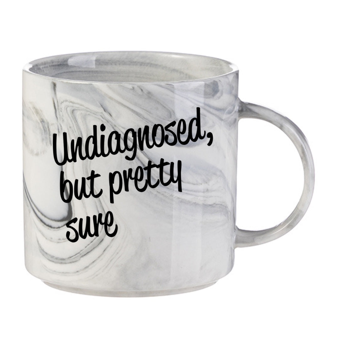 Scouse Bird Shop 11oz ceramic mug in grey marble with black text reading Undiagnosed But Pretty Sure.